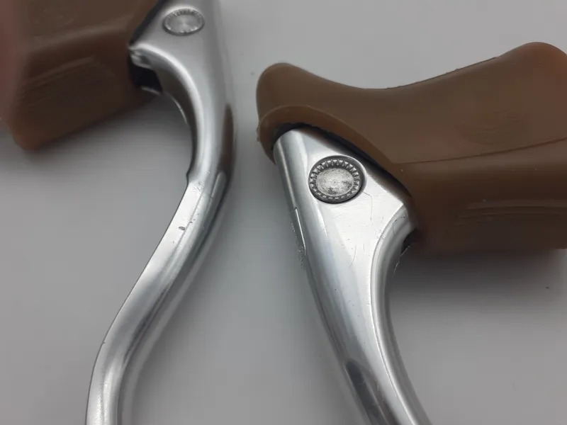 Campagnolo Triomphe Brake Levers In Silver with Gum Brown Hoods NOS Shop Soiled-5